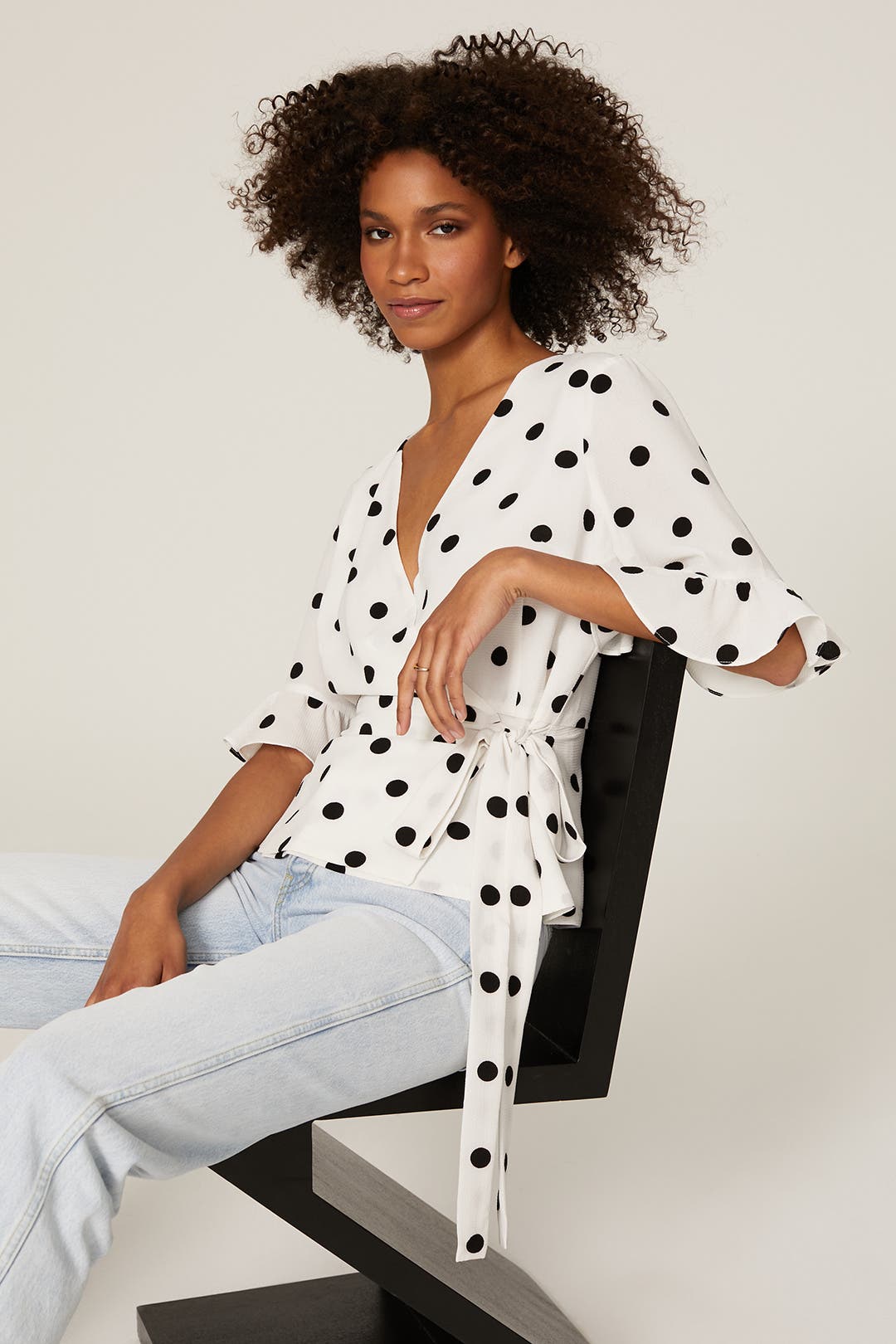 black and white polka dot wrap top