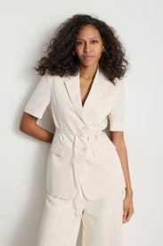 White Half Sleeve Belted Linen Jacket by DUNST