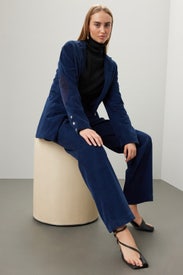 Cord Pleated Trousers by DONNI.