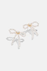 Pearl Bow Stud Earrings by Lele Sadoughi