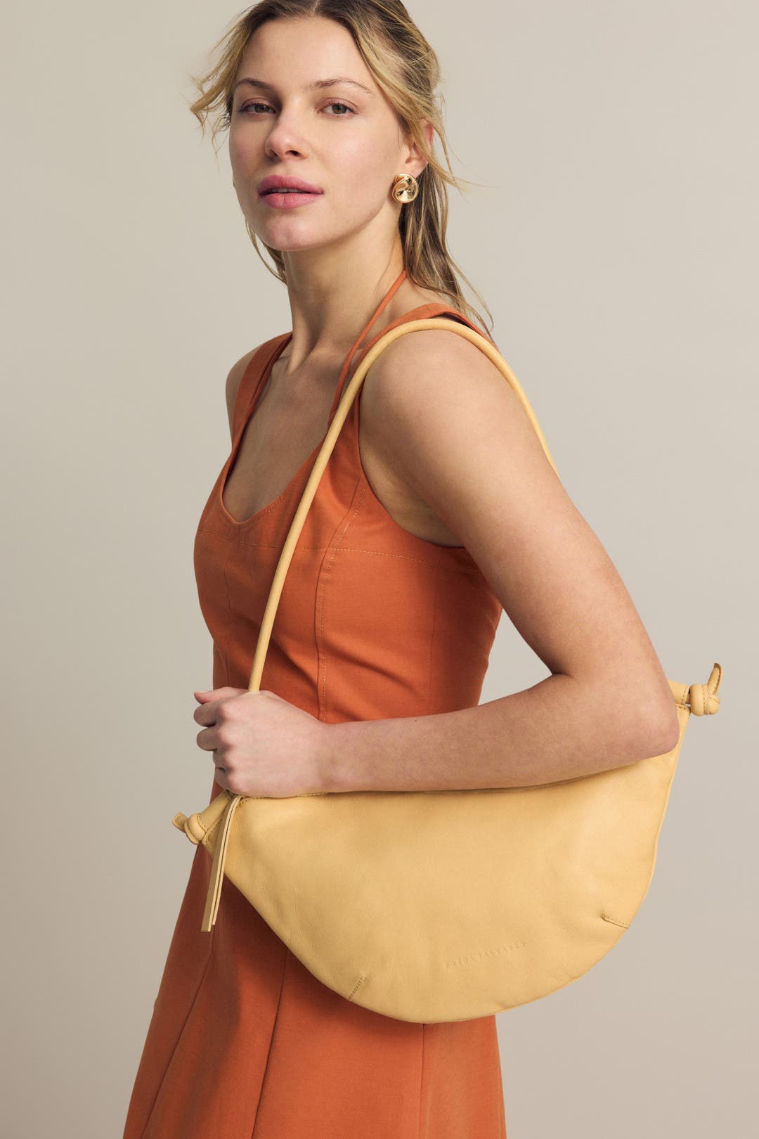 Elodie Crescent Bag by Freda Salvador Handbags | Rent the Runway